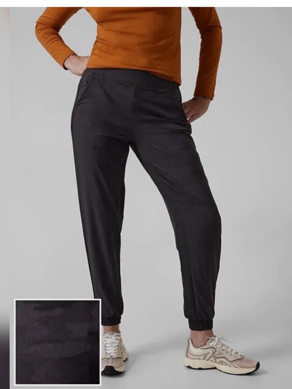 Athleta Brooklyn Lined Black Camo joggers a tapered leg and elastic waistband.